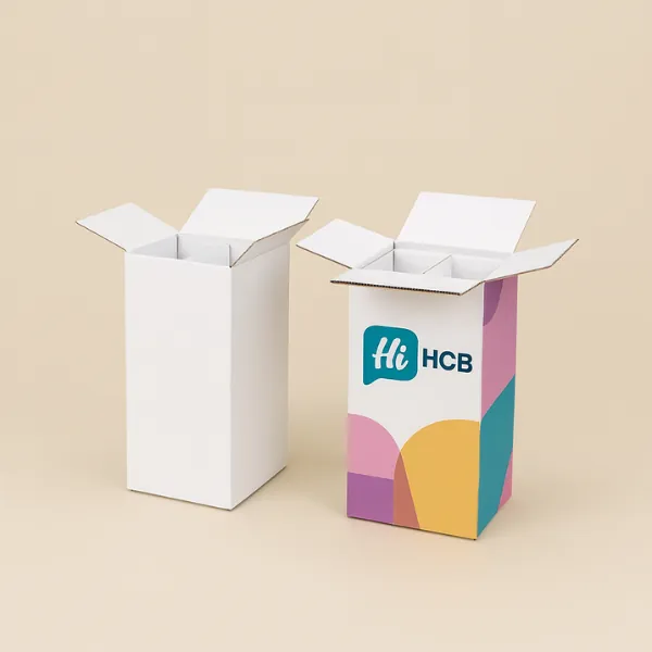 Two tall corrugated cardboard shipping boxes with open top flaps- one plain white and one with colorful Hi HCB printed branding- class=