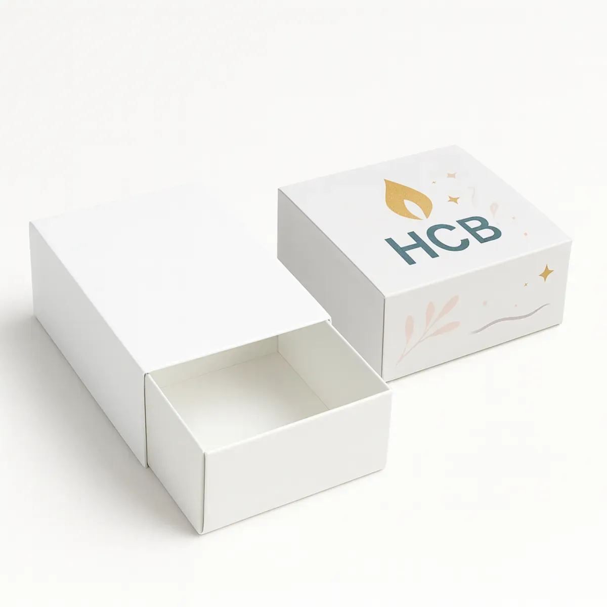 Sliding drawer-style candle box with sleeve- shown in plain white and custom printed design with HCB logo and minimal artwork class=