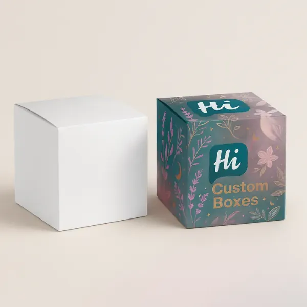 Cube-shaped folding carton boxes- one plain white and one fully printed with floral and celestial illustrations and custom branding