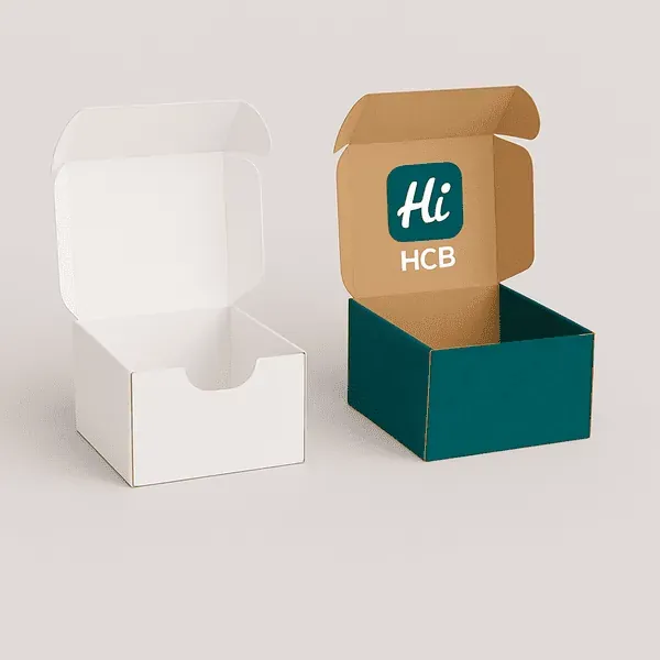 Candle shipping boxes with front tab opening shown in plain white and custom printed kraft design