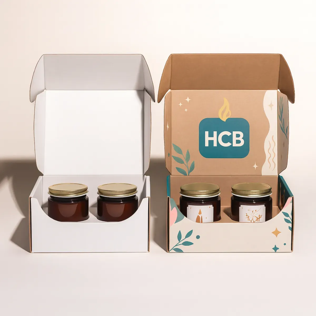 Two candle packaging boxes with open flaps- one plain white and one custom printed in pastel shades with HCB logo- candle flame- and floral motifs- designed for premium candle packaging
