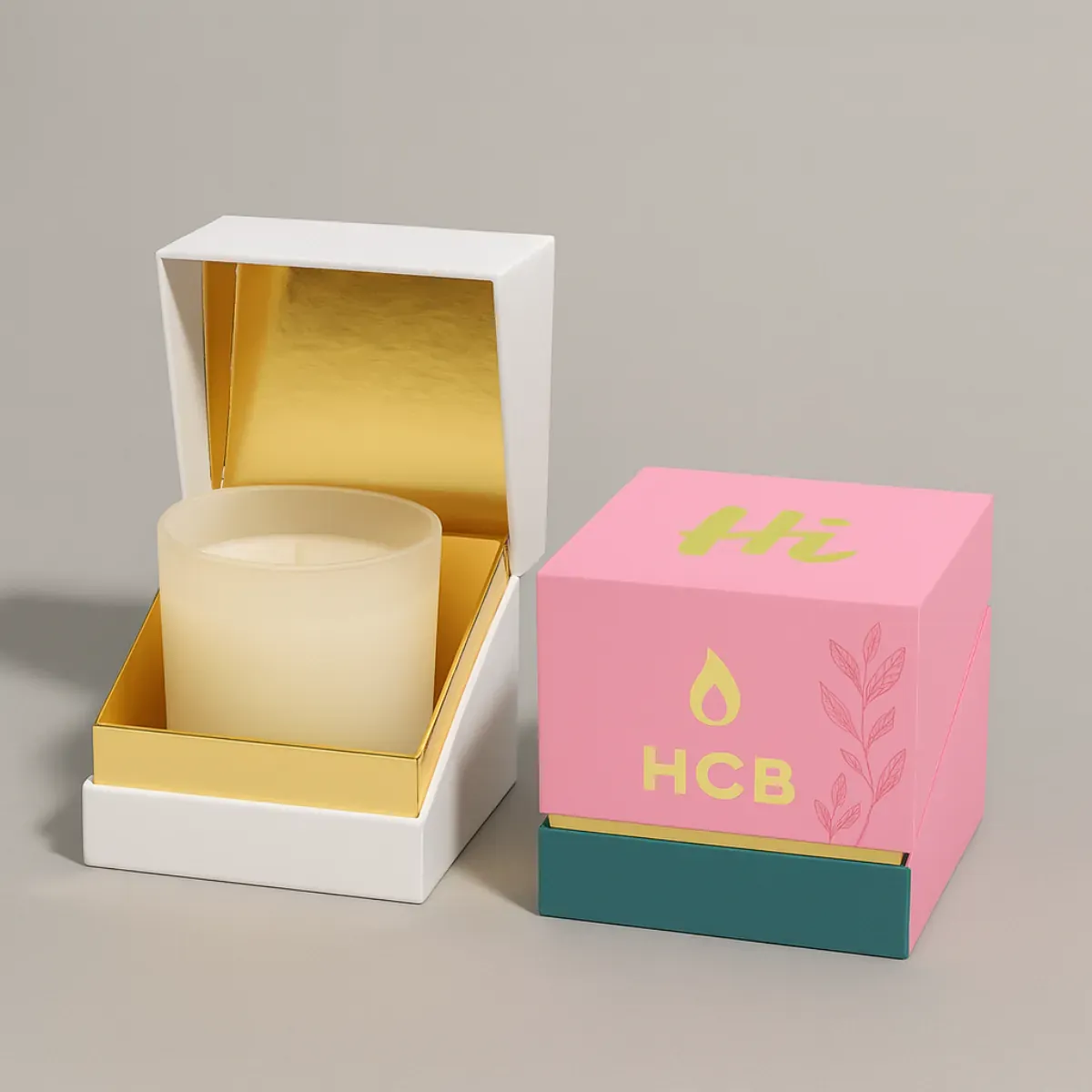 Two rigid candle gift boxes with elevator-off lids- one plain white and one custom printed in cream- purple- and teal with HCB logo- candle flame- and decorative leaves class=