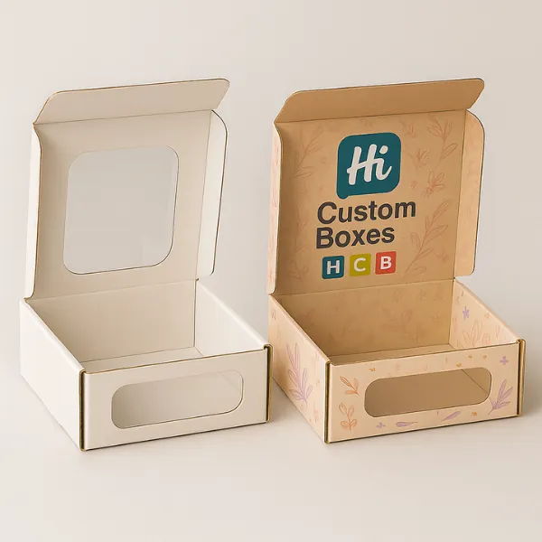 Custom mailer-style window boxes - plain kraft box on the left with clear window and printed floral box on the right with Hi Custom Boxes logo inside the lid-