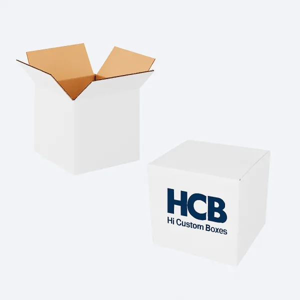 Two white corrugated shipping boxes one open with kraft interior and one closed with HCB branding class=