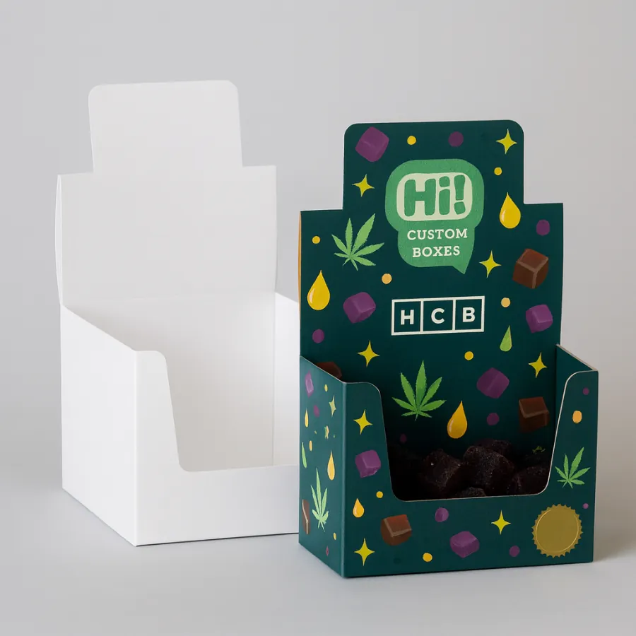 Two examples of display boxes for edibles- one plain white and one in a colorful design- shown with product inside- class=