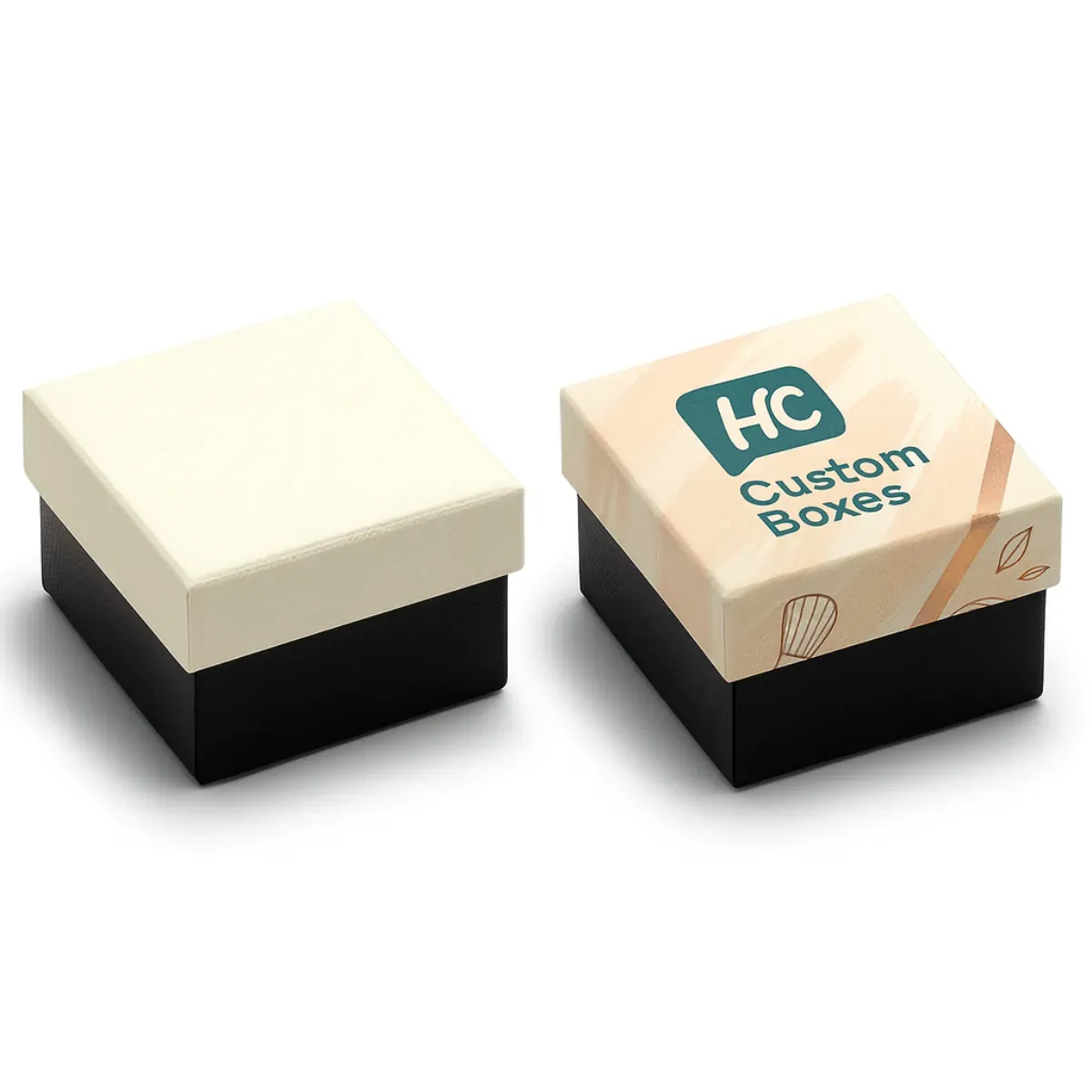 Two square rigid boxes for cosmetics packaging- One is plain cream with a black base- while the other is custom-printed with -HC Custom Boxes- logo and a soft peach design on the lid class=
