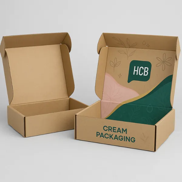 Kraft corrugated mailer box mockup with plain version on the left and custom printed version on the right- showcasing inside lid design with pastel graphics and -HCB Cream Packaging- branding- class=
