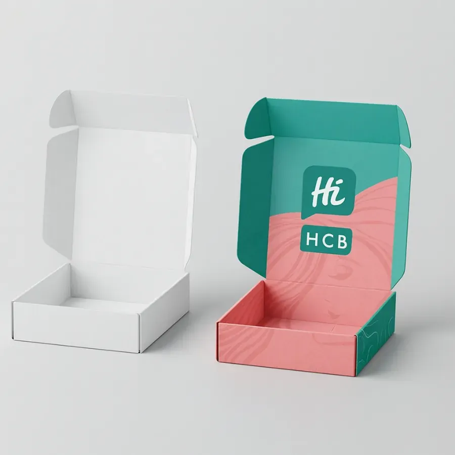 Shampoo mailer boxes in white and custom printed design- opened to show interior branding with HCB logo class=