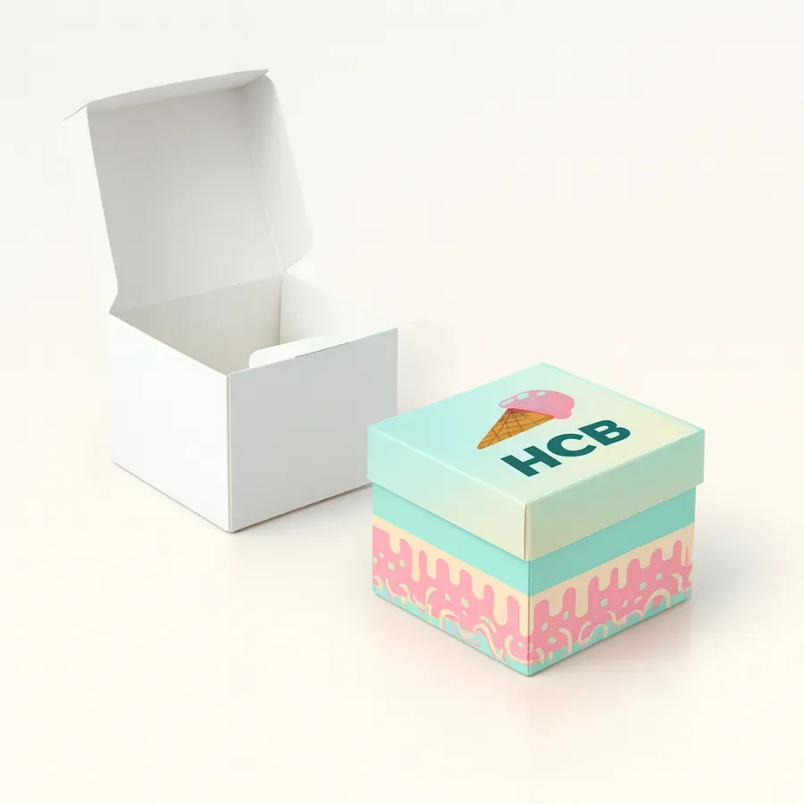 Small ice cream cardboard box with a separate elevator-off lid- featuring a colorful base with a dripping pattern and a branded lid- shown next to a plain white open box class=