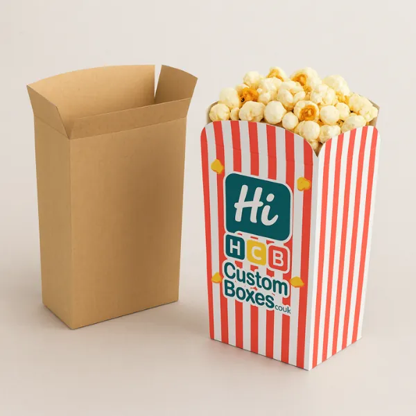 Straight-cut popcorn boxes - one plain kraft- the other red-striped and packed full of popped corn- class=