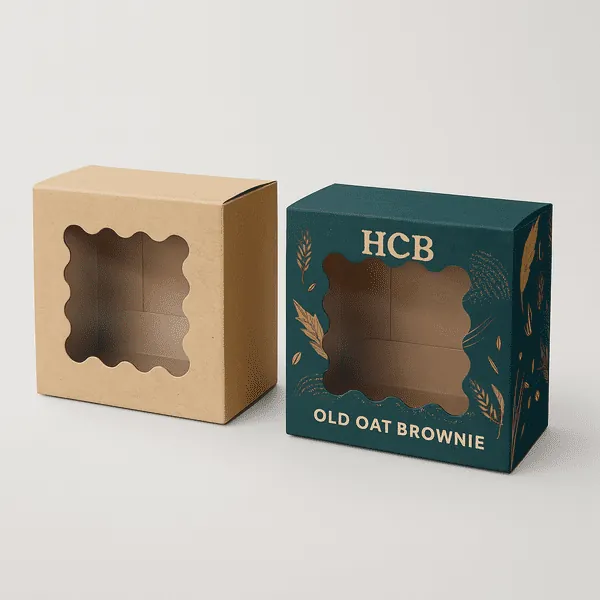 Two bakery boxes with scalloped windows plain kraft and dark green printed with HCB branding class=