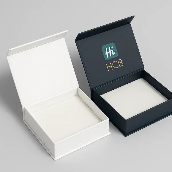 Luxury hinged gift boxes - one plain white- one navy with gold HCB logo inside the lid- class=