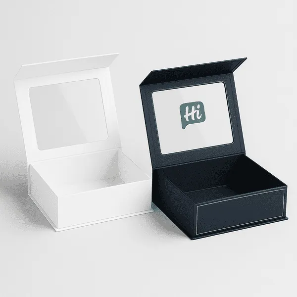 Two open luxury rigid boxes with clear lid windows one plain white and one navy blue with Hi branding class=