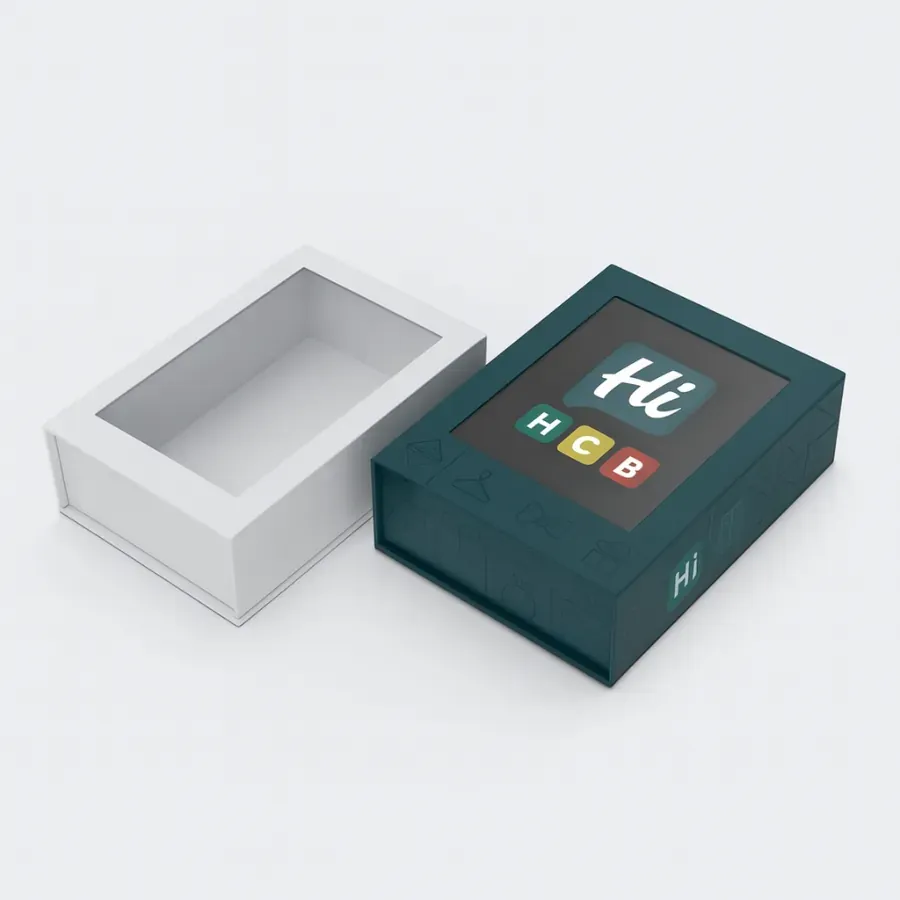 Wholesale collapsible rigid boxes with a custom window lid- The white box lid is removed to show the window- next to a branded dark teal box with a custom logo displayed through the clear window class=