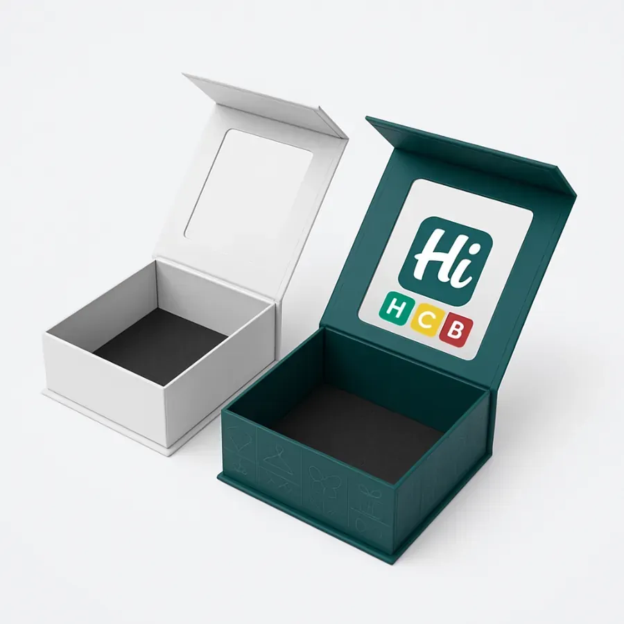 Rigid collapsible box with a magnetic flap and a display window on the inside lid- Both the white and custom-printed teal boxes contain a black foam insert class=