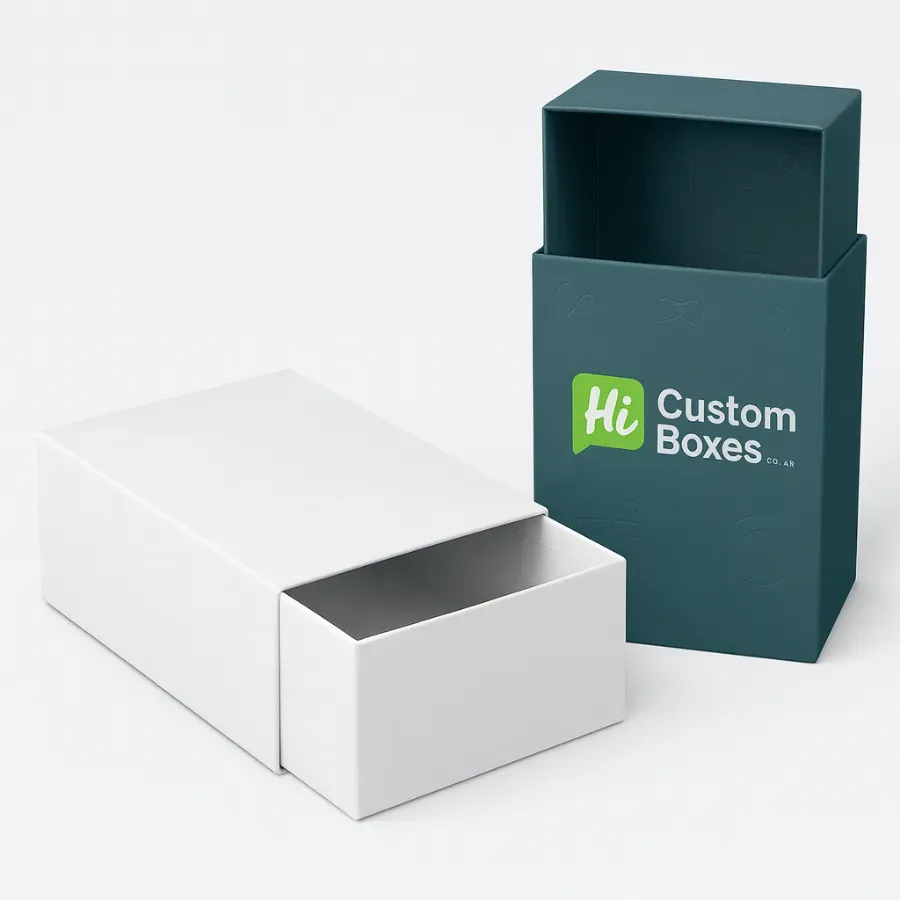Custom slide-out drawer boxes- or two-piece rigid boxes with sliding sleeves- One box is a plain white drawer style- and the other is a custom-printed dark teal sleeve box class=