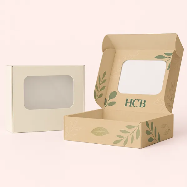 Two rectangular soap boxes with windows - one plain cream- one kraft with leafy HCB branding inside- class=