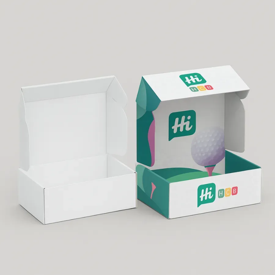 Pair of open mailer-style cartons- the left is blank white- the right features a playful golf-course illustration and -Hi HCB- logos printed inside and outside class=