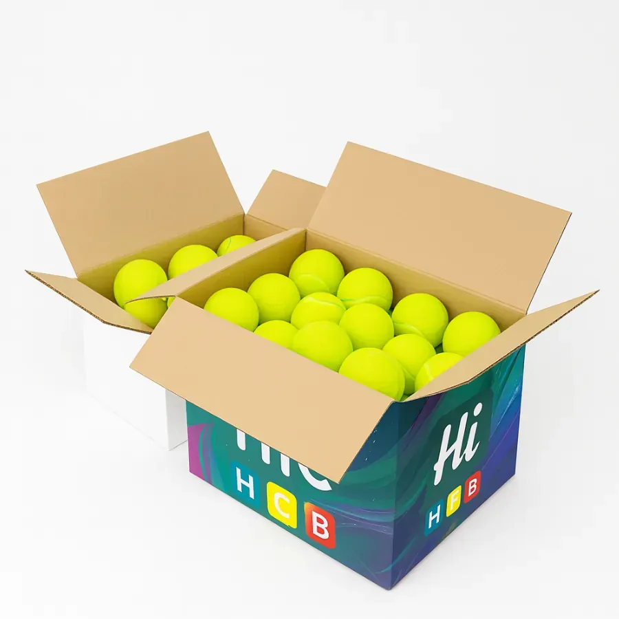 Large corrugated packaging boxes- plain white and custom Hi HCB printed- filled with multiple neon yellow tennis balls for wholesale storage class=