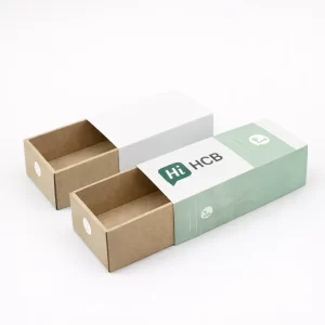Two sliding drawer boxes made of kraft paper with white and mint green branded sleeves- class