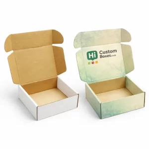 Two open corrugated cardboard mailer boxes, one plain white and one featuring a green logo.