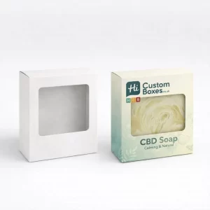 Two square soap boxes with large die-cut windows, one plain white and one containing soap.