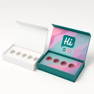Two luxury rigid setup boxes with magnetic lids and circular cut-out inserts- one plain white and one custom-printed with Hi HCB logo and colorful abstract design