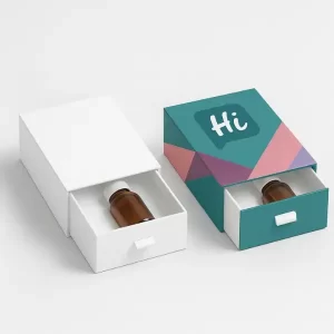Drawer-style rigid boxes containing small bottles- shown in plain and fully branded designs with the HCB logo and geometric pattern