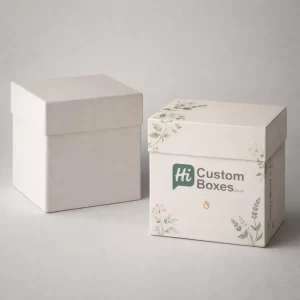 Two elegant square gift boxes with floral illustrations, one plain and one featuring custom branding.