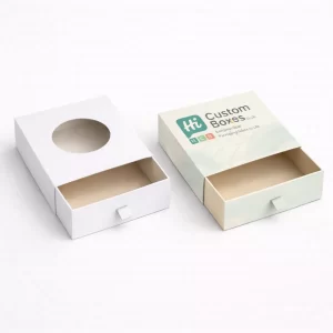Two drawer-style slide boxes, featuring a circular window and a small fabric pull tab.
