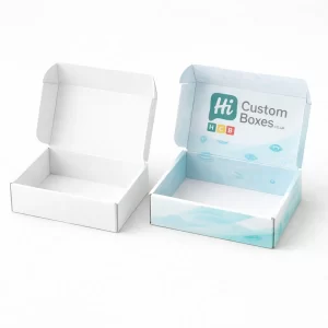 Two open mailer-style boxes, one plain white and one printed with light blue graphics and a logo.