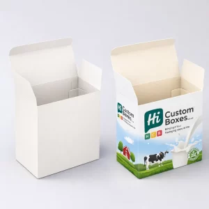 Two open mailer boxes, one plain white and one featuring a colourful pastoral cow and milk graphic.