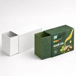 Two tall rectangular product boxes, one blank white and one printed with hair oil graphics.