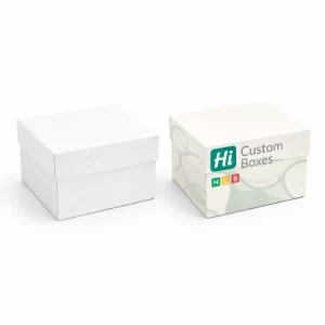 Two square two-piece rigid boxes with lids; one is plain white and one is branded.