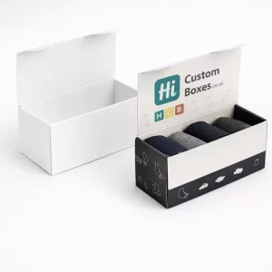 Two rectangular hinged lid boxes, one plain white and one printed with black sock patterns.