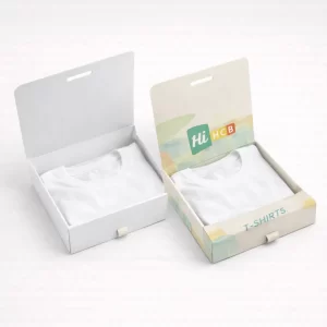 Two shallow t-shirt boxes with hinged lids open, displaying neatly folded white t-shirts inside.