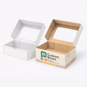 Two open rectangular cardboard boxes with large clear windows on the lids for food visibility.