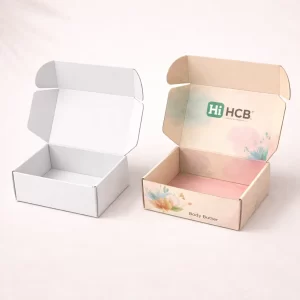 Two sturdy white two-piece boxes with lids, including one featuring custom pink body butter branding.