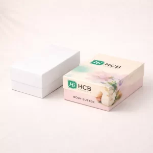 Two premium flip-top magnetic boxes, one blank white and one branded with elegant pink illustrations.