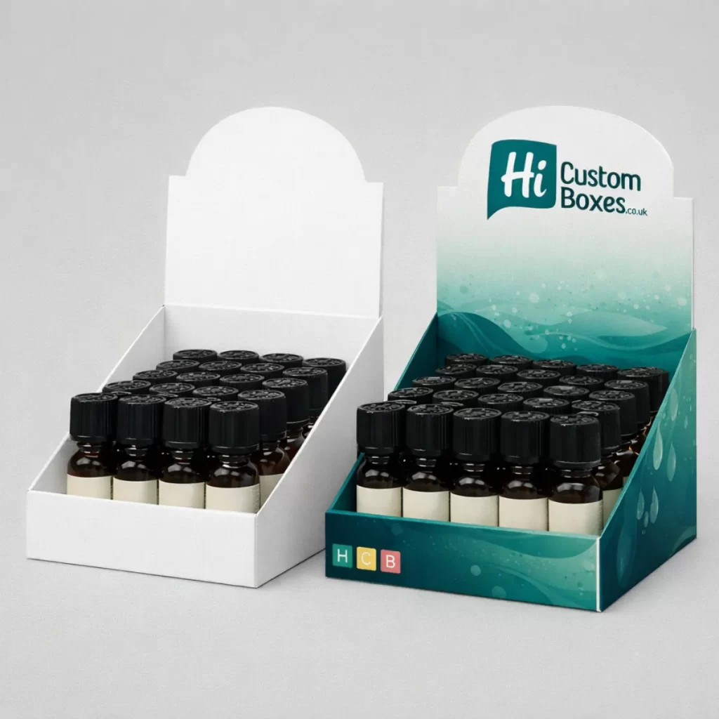Side-by-side cardboard counter displays filled with rows of small amber glass bottles with black caps