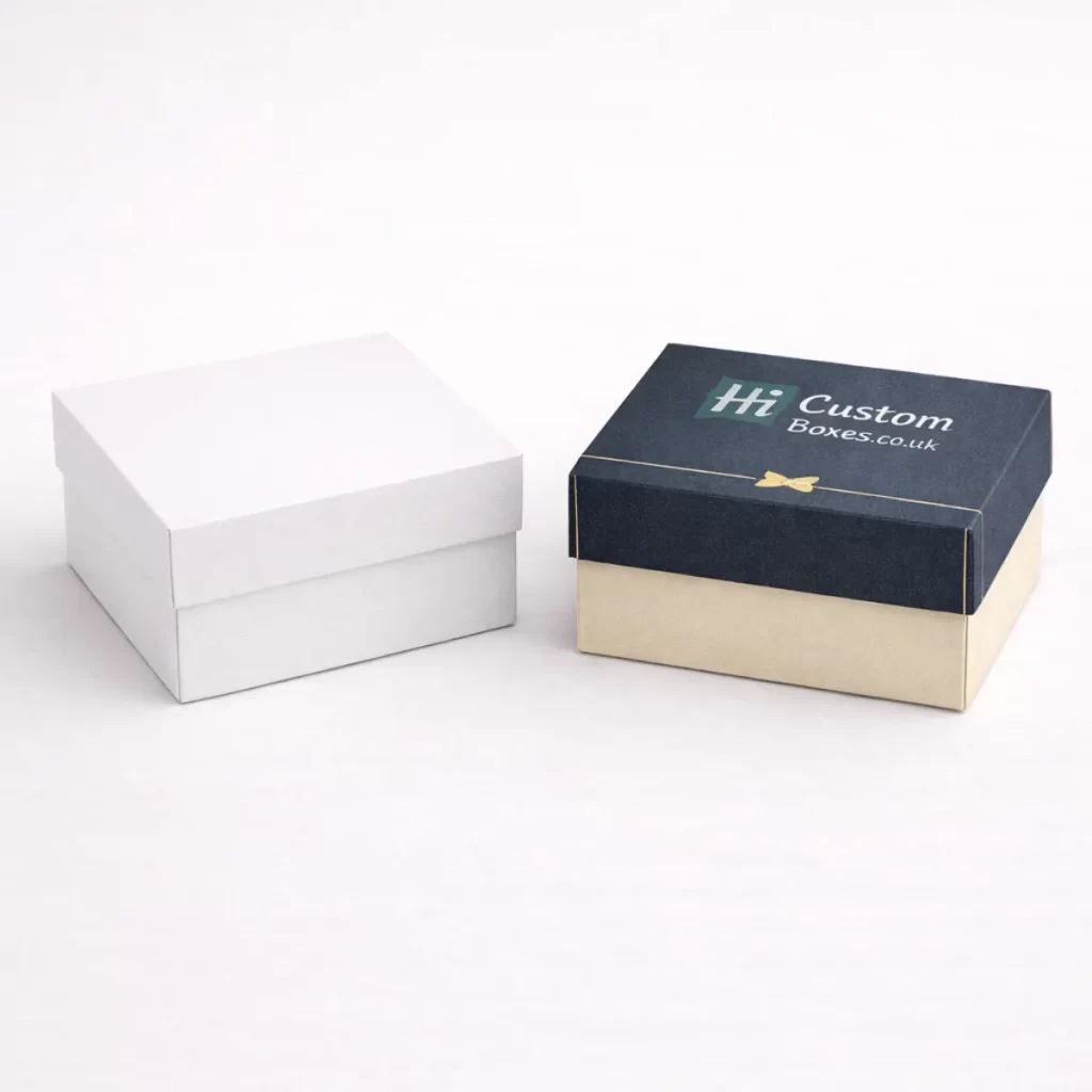 Two premium two-piece square gift boxes with lids, shown in white and branded navy blue.