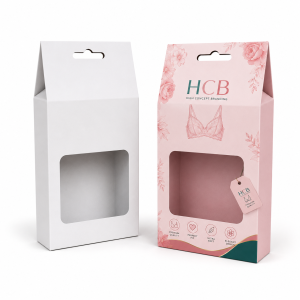 Gable style pink and white cardboard boxes with hanging holes and clear windows for underwear.