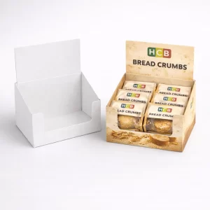 A white cardboard counter display unit next to a branded version filled with individual breadcrumb sachets.