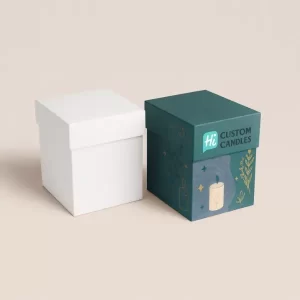 Cube-shaped folding carton boxes, one plain white and one fully printed with floral and celestial illustrations and custom branding.