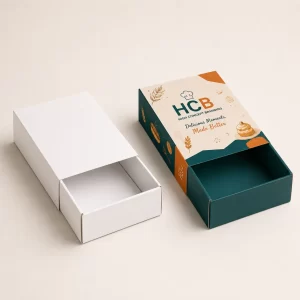 Matchbox style choux packaging with a white outer sleeve and a branded pink inner tray.