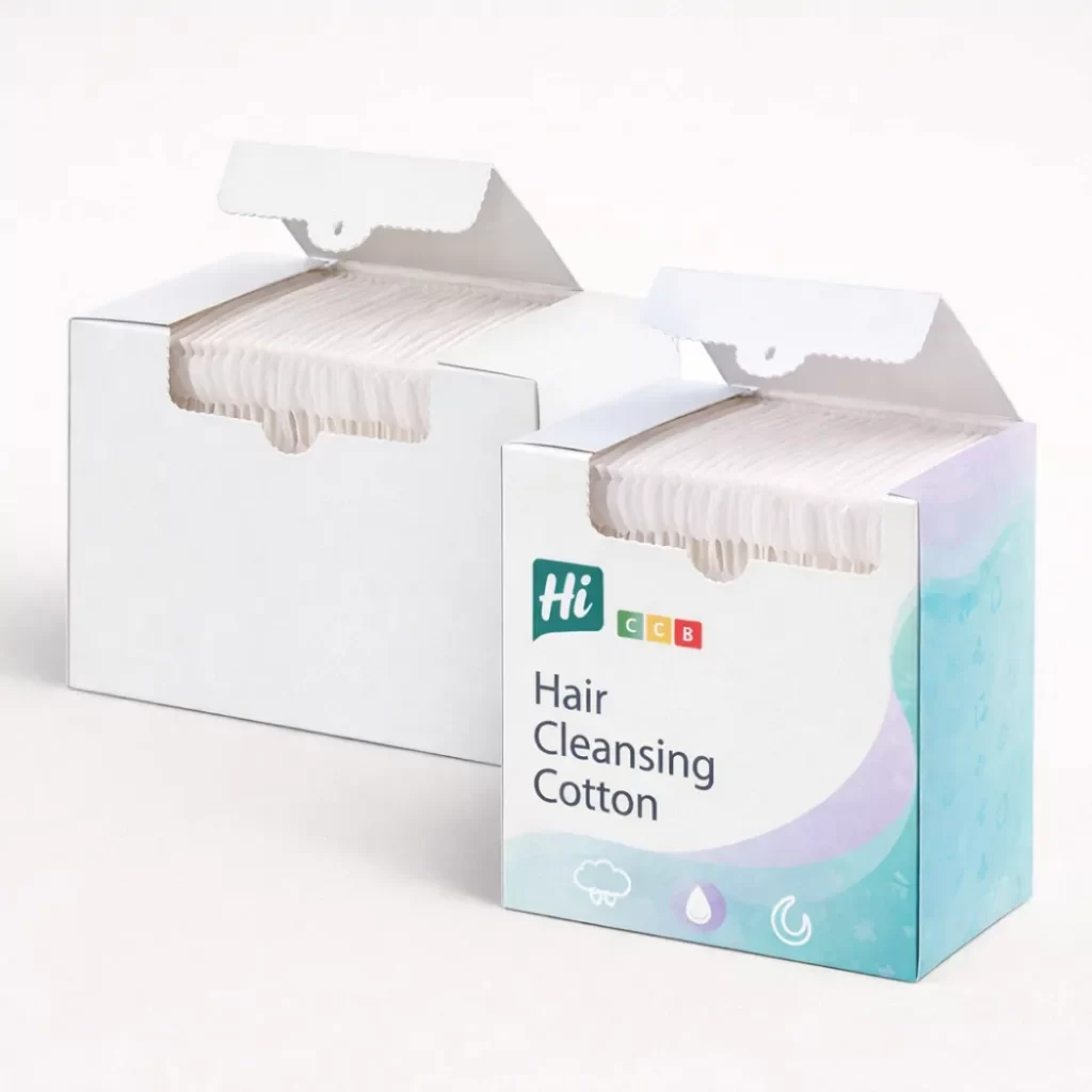 Two white boxes of hair cleansing cotton pads- one plain and one with blue branding