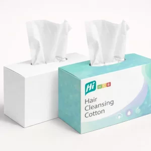 Two horizontal dispenser boxes for hair cleansing cotton- showing tissues being pulled from the top