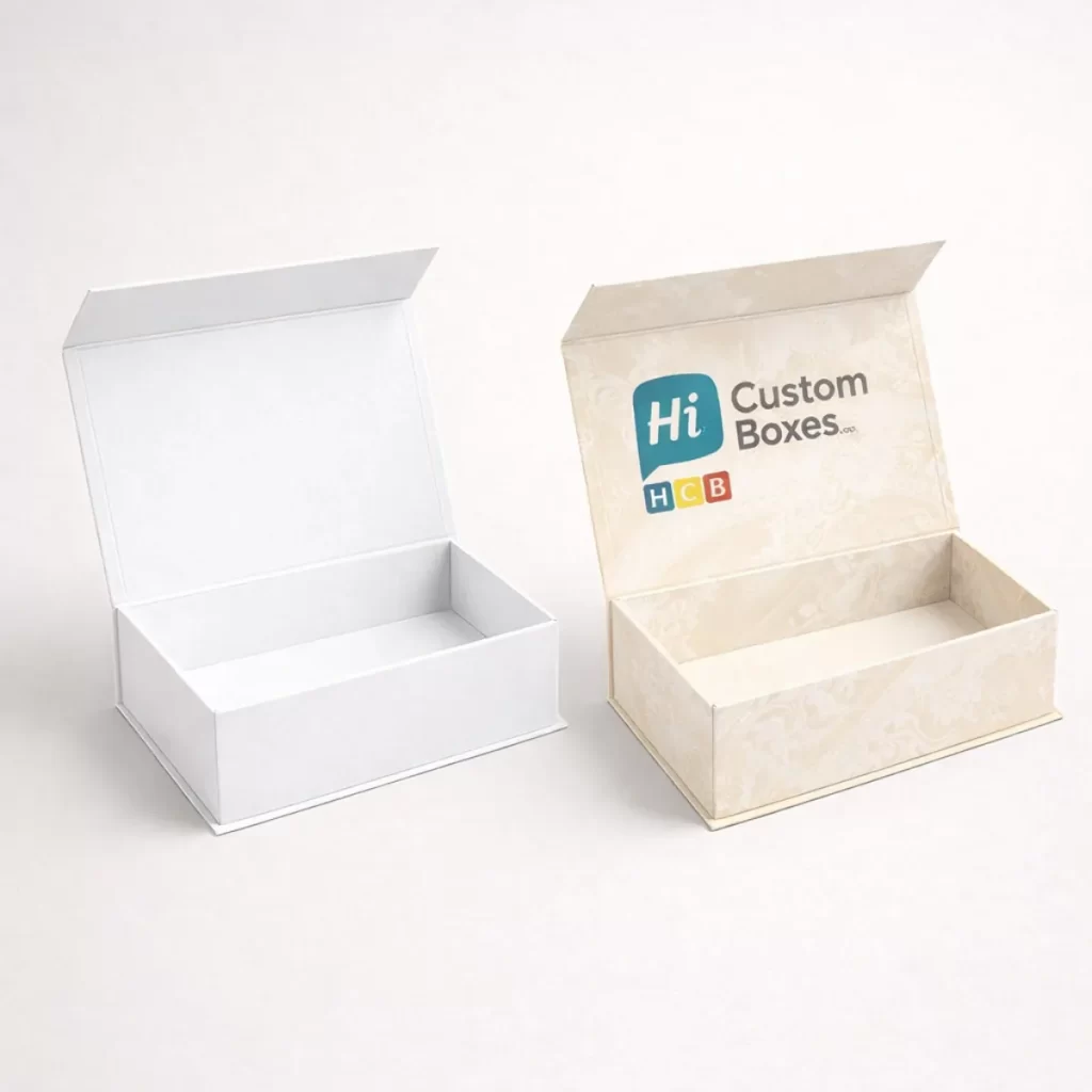 Two open magnetic-closure rigid boxes, one plain white and one with a sophisticated cream floral pattern.