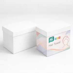 Two rectangular gift boxes with lids, one plain white and one decorated with soft pastel patterns.