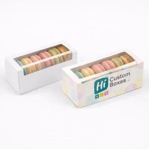 Two rectangular white boxes with clear windows, one plain and one with branded pastel circles.